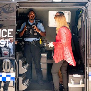 A police officer leads a tour through a Chicago Police Department mobile command vehicle